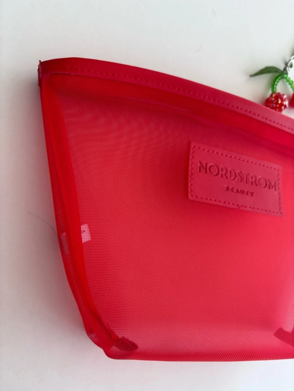 Nordstrom Beauty Bright Red Mesh Cosmetic Pouch with Wrist Strap and Cherry Char